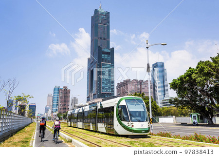 Low angle view of circular light rail train and the metropolitan building in Kaohsiung, Taiwan. The Circular Light Rail System in Kaohsiung is the first in Taiwan. 97838413