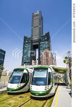 Low angle view of circular light rail train and the metropolitan building in Kaohsiung, Taiwan. The Circular Light Rail System in Kaohsiung is the first in Taiwan. 97838414