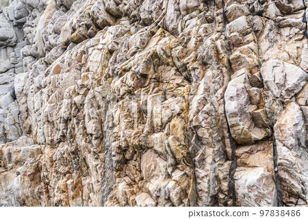 Close-up of rock surface texture as an abstract background 97838486