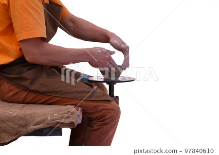 Potter makes clay pottery on circle. Pottery and craftsmanship concept.  Isolated on white background. 97840610