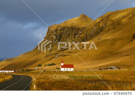 Reyniskirkja church and typical landscape of southern Iceland Reyniskirkja church and typical landscape of southern Iceland 97840970