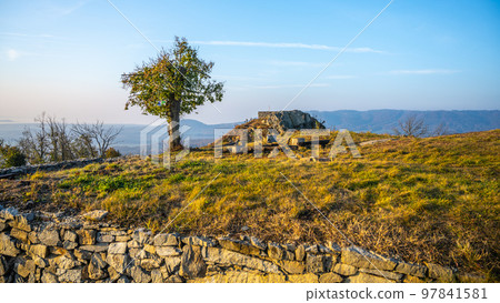 Kalich medieval castle ruins on the mountain summit. Used by Hussite movement army leader Jan Zizka of Trocnov. Trebusin village in Central Bohemian Uplands, Czech Republic 97841581