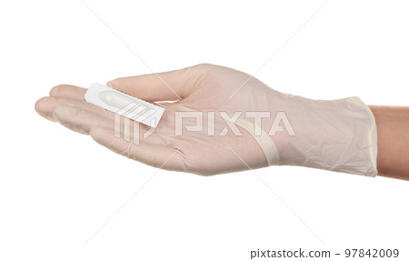Doctor holding suppository on white background. Hemorrhoid problems 97842009