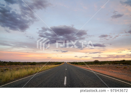 Outback beautiful magic hour and straight road 97843672