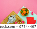 Chinese language mean rich or wealthy and happy.Top view aerial image decoration Chinese new year  lunar new year holiday background concept.Flat lay red orange with blossom on modern  paper. 97844497