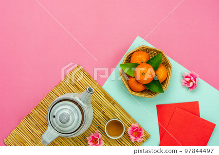 Chinese language mean rich or wealthy and happy.Top view aerial image decoration Chinese new year  lunar new year holiday background concept.Flat lay red orange with blossom on modern  paper. 97844497