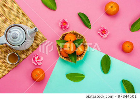 Chinese language mean rich or wealthy and happy.Top view aerial image decoration Chinese new year lunar new year holiday background concept.Flat lay red orange with blossom on modern paper. Chinese language mean rich or wealthy and happy.Top view aerial image decoration Chinese new year lunar new year holiday background concept.Flat lay red orange with blossom on modern paper. 97844501