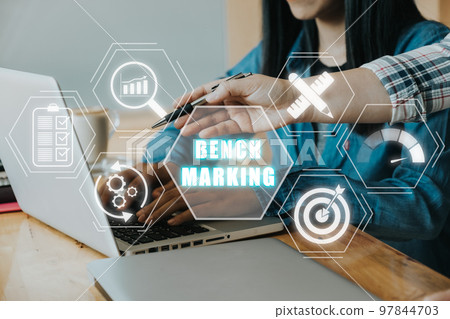 Business concept of benchmark, Business person team working on laptop computer with benchmarking icon on virtual screen, Business, Technology, Internet and network. Business concept of benchmark, Business person team working on laptop computer with benchmarking icon on virtual screen, Business, Technology, Internet and network. 97844703