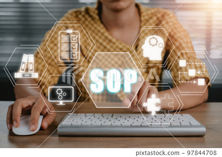 SOP, Standard Operating Procedure concept, Business woman working on computer with SOP icon on virtual screen. 97844708