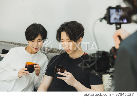 A couple relaxing on the sofa Shooting A couple relaxing on the sofa Shooting 97845127