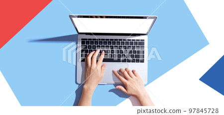 Person using a laptop computer 97845728
