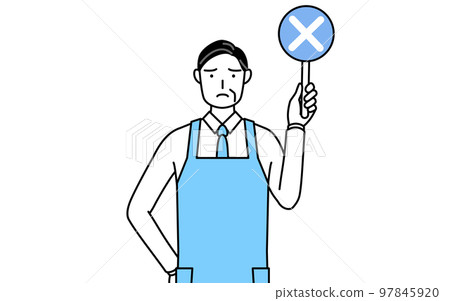 A senior man wearing an apron with a cross stick showing an incorrect answer A senior man wearing an apron with a cross stick showing an incorrect answer 97845920