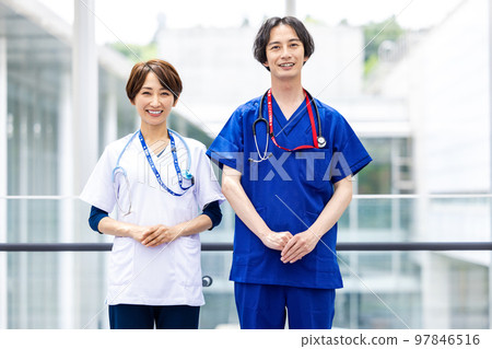 Young doctors and nurses working in a medical facility Young doctors and nurses working in a medical facility 97846516