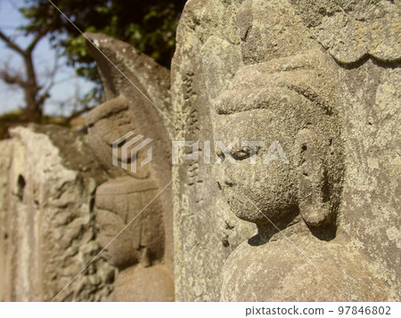 Roadside stone Buddha in early spring 97846802