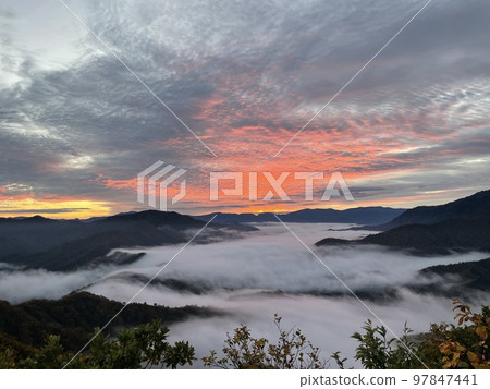 Echigo-Komagatake sunrise and waterfall clouds Echigo-Komagatake sunrise and waterfall clouds 97847441
