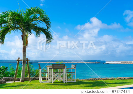 Okinawa Miyakojima emerald blue sea and palm trees 97847484