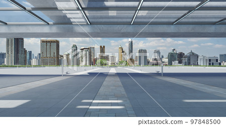 Perspective view of empty floor and modern rooftop building Perspective view of empty floor and modern rooftop building 97848500