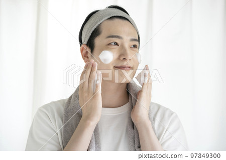 A young man who puts foam on his face Washing face Skin care Image 97849300