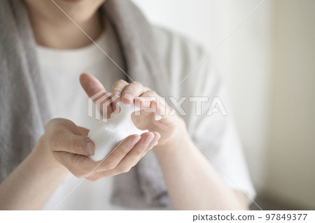 Young man's hand with soap bubbles Young man's hand with soap bubbles 97849377