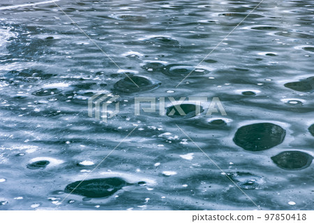 Frozen lake surface 97850418