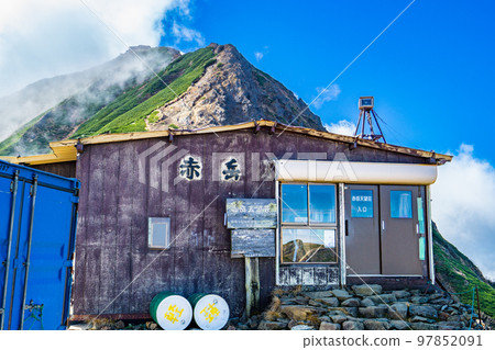 Climbing Yatsugatake in Nagano Prefecture: The summit of Mt. Akadake seen from Akadake Observatory 97852091