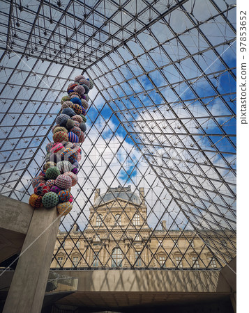 Underneath the Louvre glass pyramid, vertical background. Beautiful architecture details with an abstract mixture of classical and modern styles Underneath the Louvre glass pyramid, vertical background. Beautiful architecture details with an abstract mixture of classical and modern styles 97853652