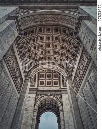 View underneath triumphal Arch (Arc de triomphe) in Paris, France. Architectural details of the famous historic landmark. 97853672