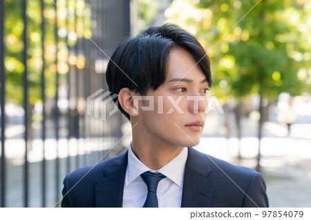 Fashion snap of a cool man in a suit office worker new graduate job change business portrait 97854079