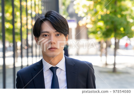 Fashion snap of a cool man in a suit office worker new graduate job change business portrait Fashion snap of a cool man in a suit office worker new graduate job change business portrait 97854080