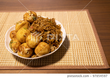 A large serving of takoyaki and yakisoba A large serving of takoyaki and yakisoba 97854597