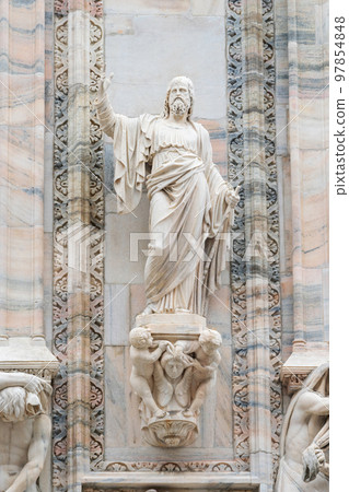 Gothic marble statues on Cathedral of Milan Duomo di Milano, outside decoration statues. Largest church in Italy 97854848