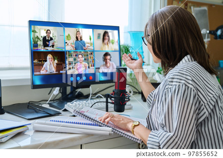 Female teacher working at home, online lesson with group of teenage students 97855652