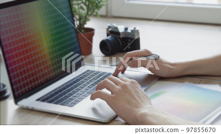 young designer using a laptop . people and technology. 97855670