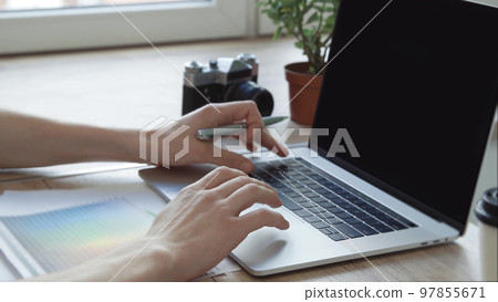 young designer choosing the right color for a new project. blank screen for your text young designer choosing the right color for a new project. blank screen for your text 97855671