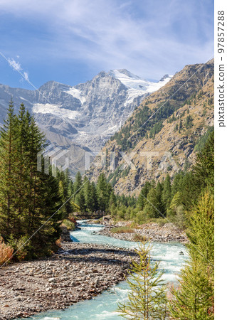 Alpine water stream in Gran Paradiso National Park runs along rapids Alpine water stream in Gran Paradiso National Park runs along rapids 97857288