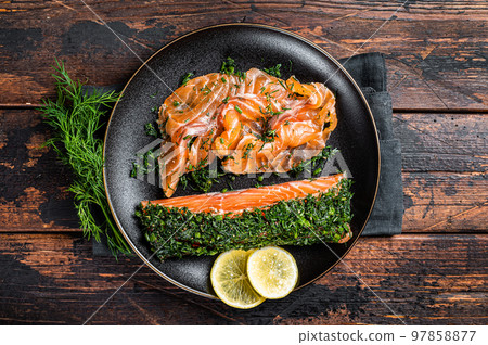 Cured Salmon fillet with dill, salt and papper, gravlax. Wooden background. Top view 97858877