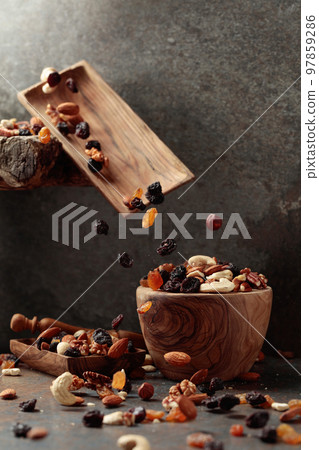 Falling dish with nuts and raisins. Falling dish with nuts and raisins. 97859286
