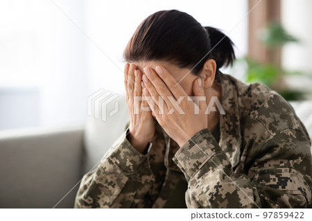 Military Mental Health. Soldier Female Sitting On Couch, Covering Face In Despair 97859422