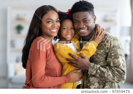 Military Family. Portrait Of African American Male Soldier With Wife And Daughter Military Family. Portrait Of African American Male Soldier With Wife And Daughter 97859478