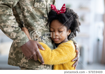 Closeup Of Little African American Girl Cuddling Military Father In Uniform 97859489