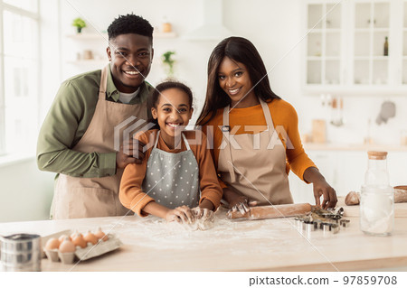 Happy African American Family Baking Kneading Dough In Kitchen 97859708