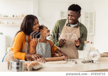 African American Family Baking Using Forms Making Cookies In Kitchen 97859733