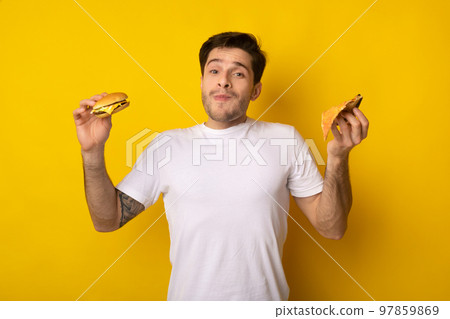Funny Guy Holding Burger And Slice Of Pizza Funny Guy Holding Burger And Slice Of Pizza 97859869