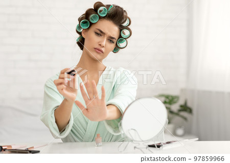 Lady Doing Nails At Home Sitting In Modern Bedroom Lady Doing Nails At Home Sitting In Modern Bedroom 97859966