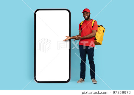 Mobile Ad. Black Delivery Guy With Thermal Backpack Pointing At Blank Smarthone Mobile Ad. Black Delivery Guy With Thermal Backpack Pointing At Blank Smarthone 97859973
