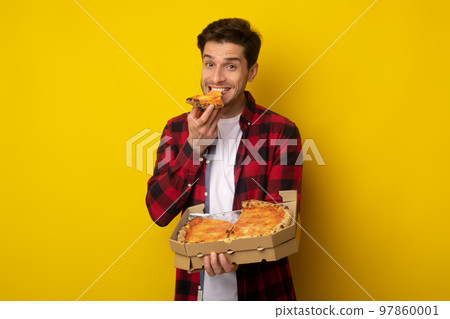 Happy Guy Holding Box Biting Pizza At Studio Happy Guy Holding Box Biting Pizza At Studio 97860001