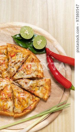 Tom Yum Pizza made by Thailand, Ingredients of Tom Yum Kung are the original curry paste, Lemongrass, Kaffir lime leaves and lime. Promotional poster for restaurant or pizza sale, Text space. 97860547
