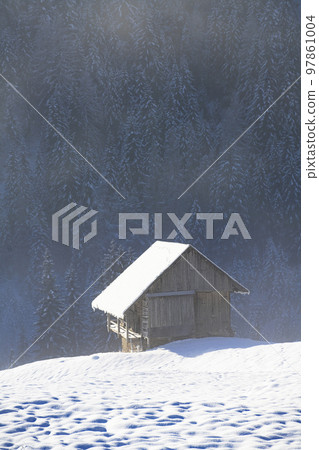 Log cabin in a winter landscape Log cabin in a winter landscape 97861004