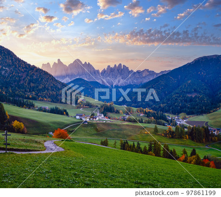 Autumn daybreak Santa Magdalena famous Italy Dolomites village view in front of the Geisler or Odle Dolomites mountain rocks. Picturesque traveling and countryside beauty concept background. Autumn daybreak Santa Magdalena famous Italy Dolomites village view in front of the Geisler or Odle Dolomites mountain rocks. Picturesque traveling and countryside beauty concept background. 97861199