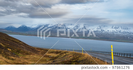 Highway road and mountain view during auto trip in Iceland. Spectacular Icelandic landscape with scenic nature Highway road and mountain view during auto trip in Iceland. Spectacular Icelandic landscape with scenic nature 97861276